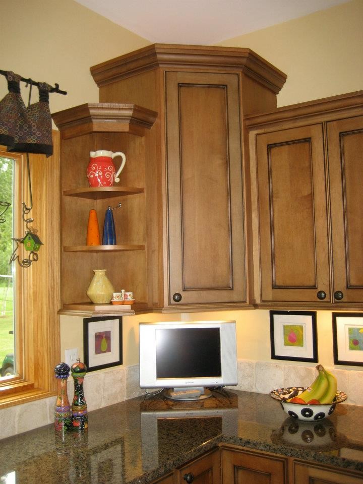 Mid-sized transitional l-shaped dark wood floor open concept kitchen photo in Milwaukee with a double-bowl sink, recessed-panel cabinets, dark wood cabinets, beige backsplash, stone tile backsplash, stainless steel appliances, an island and granite countertops