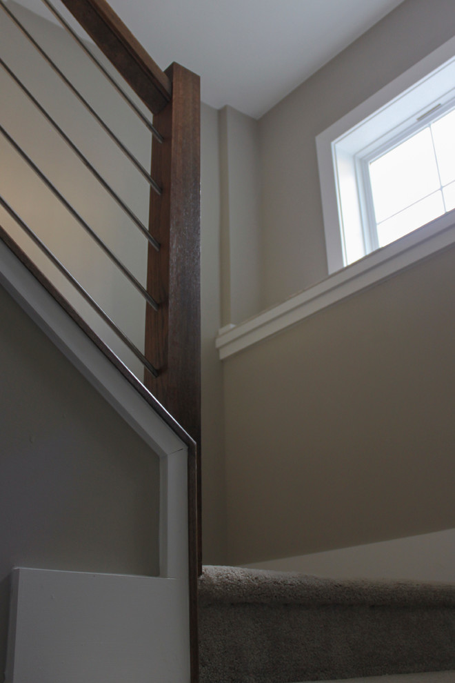 Design ideas for a large contemporary wood u-shaped staircase in DC Metro with mixed railing.