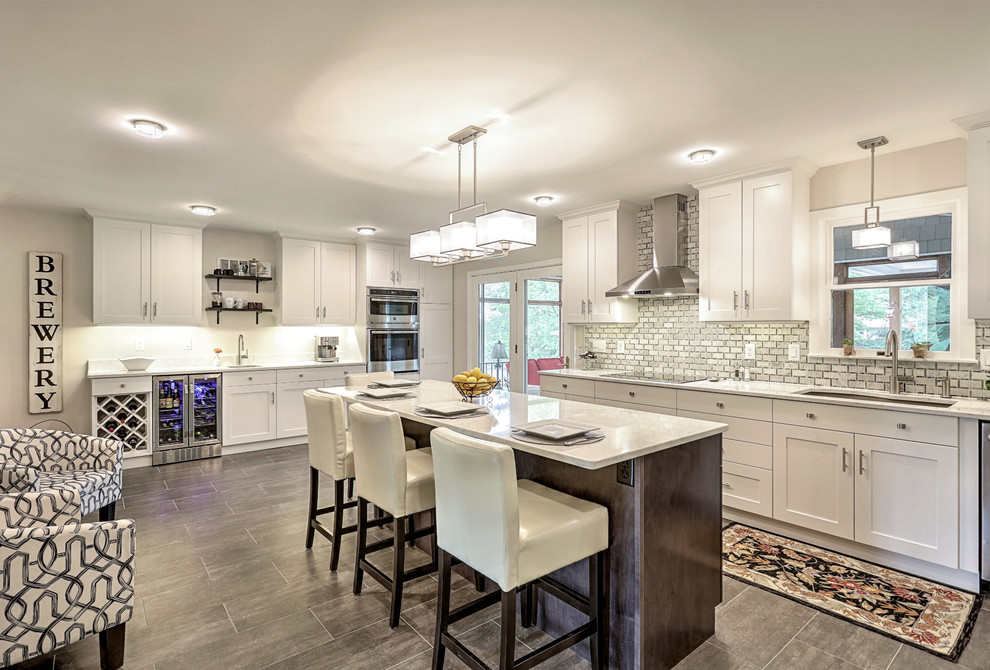Inspiration for a large transitional gray floor eat-in kitchen remodel with an undermount sink, quartz countertops, gray backsplash, marble backsplash, stainless steel appliances, an island and white countertops