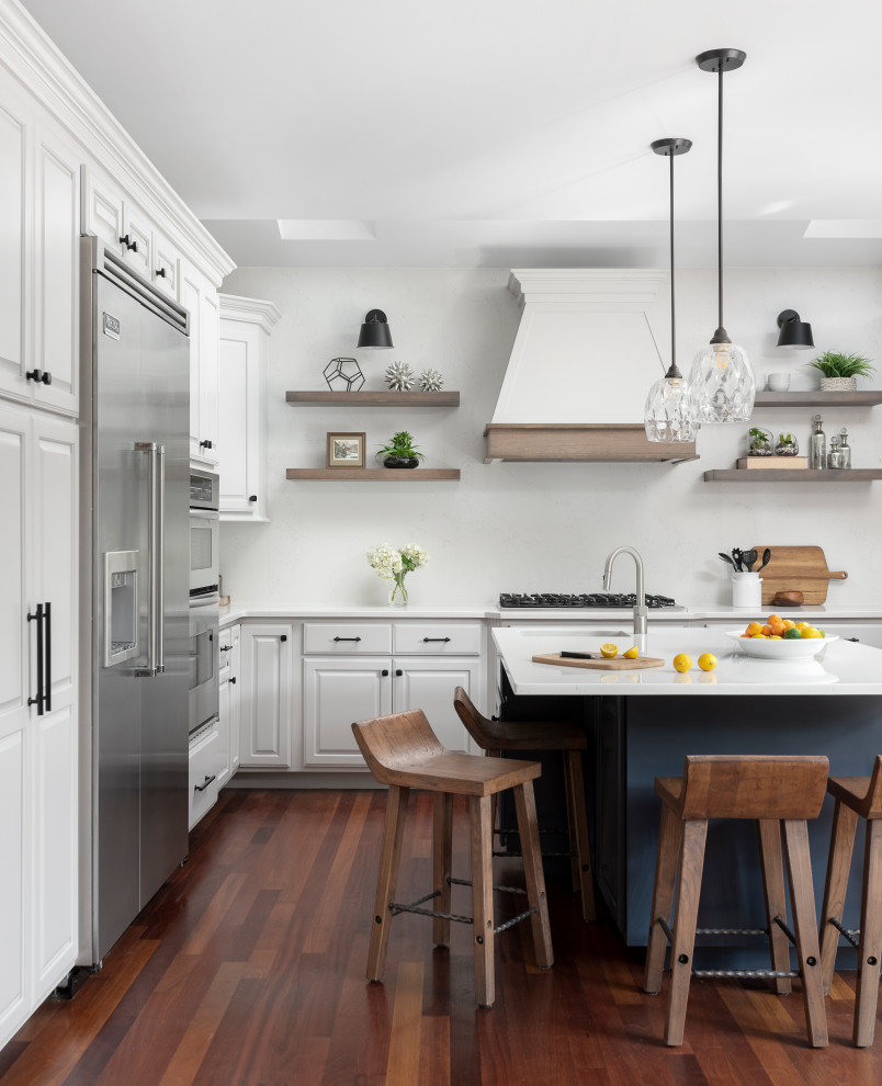 Large transitional u-shaped medium tone wood floor and vaulted ceiling eat-in kitchen photo in Chicago with a farmhouse sink, raised-panel cabinets, gray cabinets, quartz countertops, white backsplash, quartz backsplash, stainless steel appliances, an island and white countertops
