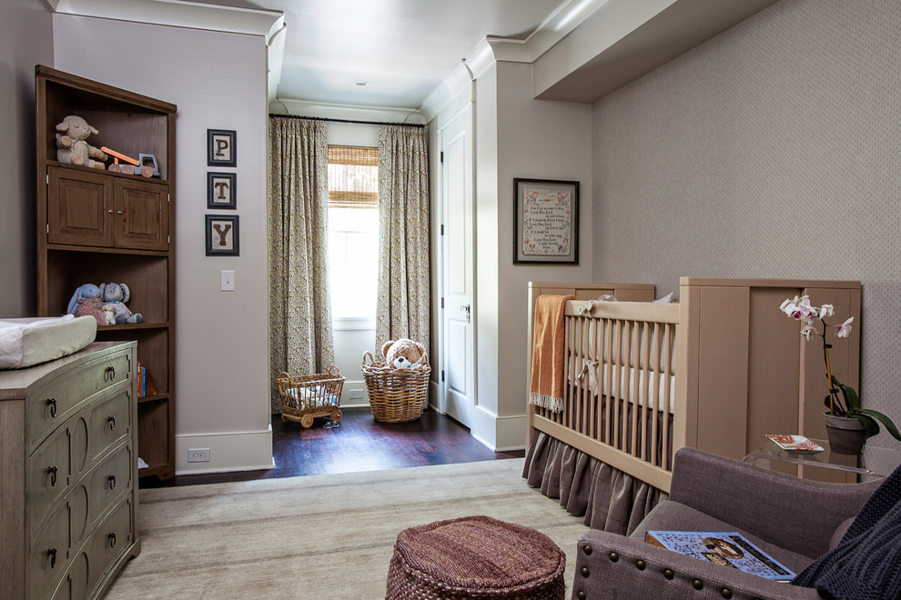 Transitional gender-neutral nursery in Charleston with grey walls and dark hardwood floors.