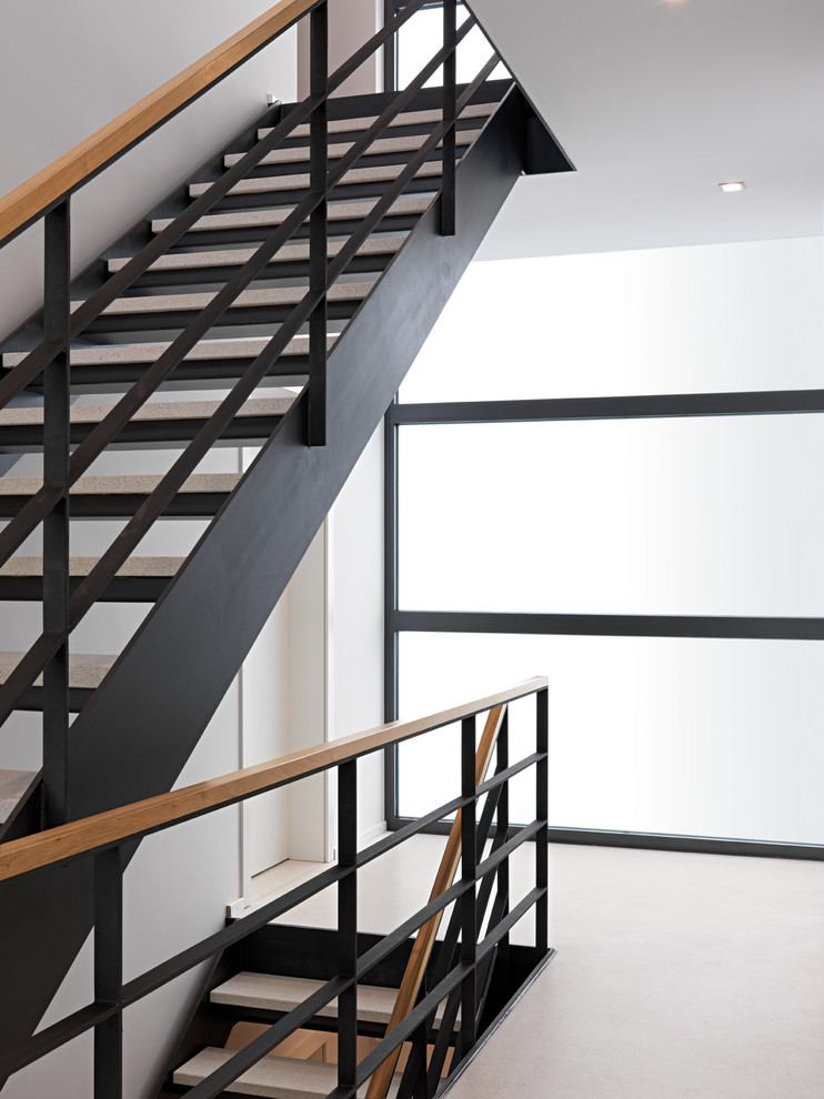 Inspiration for a mid-sized contemporary straight staircase in Stuttgart with open risers.