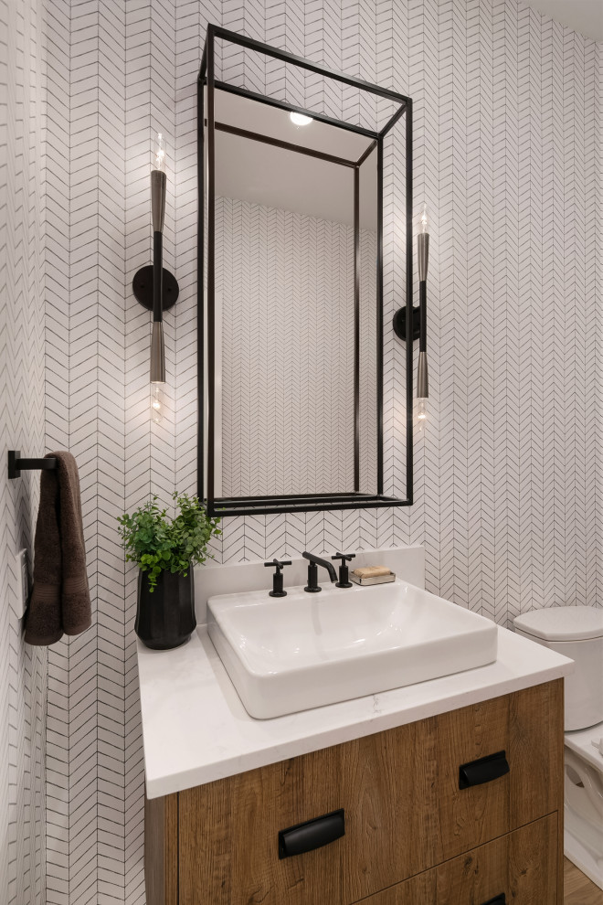 Design ideas for a large country powder room in Seattle with medium wood cabinets, white walls, white benchtops, flat-panel cabinets and medium hardwood floors.
