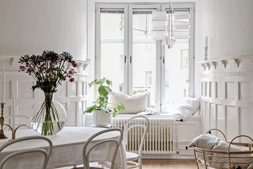 Inspiration for a traditional family room in Gothenburg with white walls.