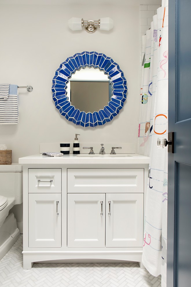 Small transitional kids bathroom in Los Angeles with white cabinets, a one-piece toilet, white walls, marble floors, an undermount sink, engineered quartz benchtops, a shower curtain, white benchtops, recessed-panel cabinets and white floor.