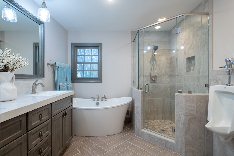 Mid-sized transitional master bathroom in Other with dark wood cabinets, a corner shower, a two-piece toilet, multi-coloured tile, beige walls, ceramic floors, an undermount sink, quartzite benchtops, beige floor, a hinged shower door and white benchtops.