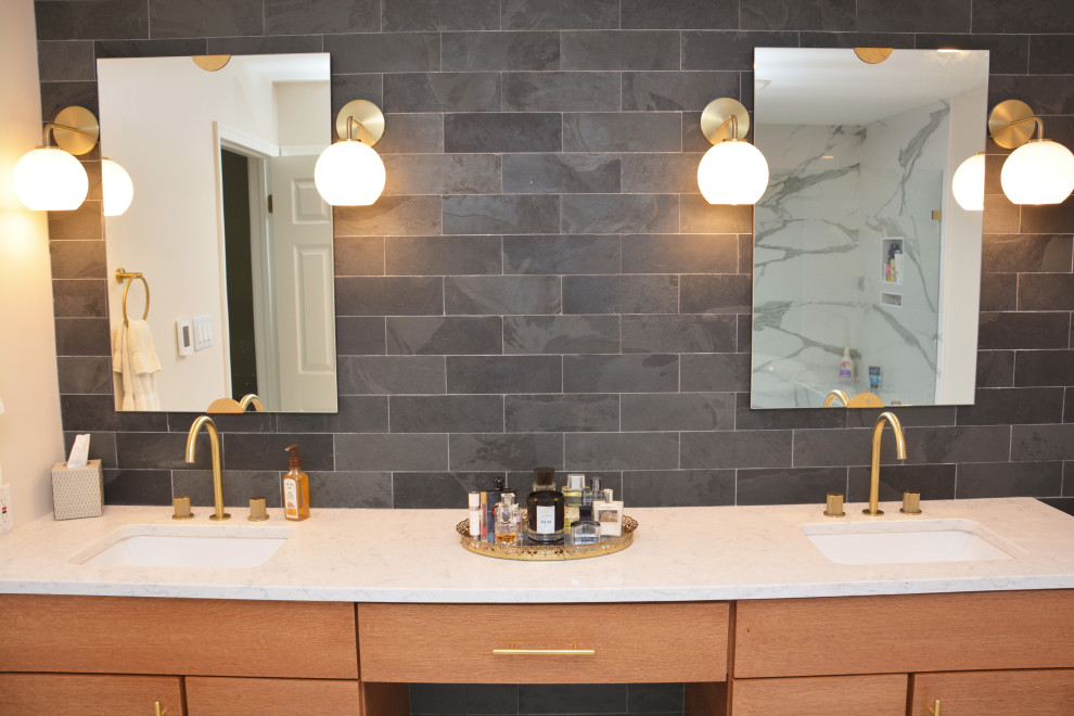 Large contemporary ensuite bathroom in DC Metro with flat-panel cabinets, light wood cabinets, a freestanding bath, an alcove shower, a two-piece toilet, black tiles, slate tiles, grey walls, a submerged sink, engineered stone worktops, white floors, white worktops, double sinks and a freestanding vanity unit.