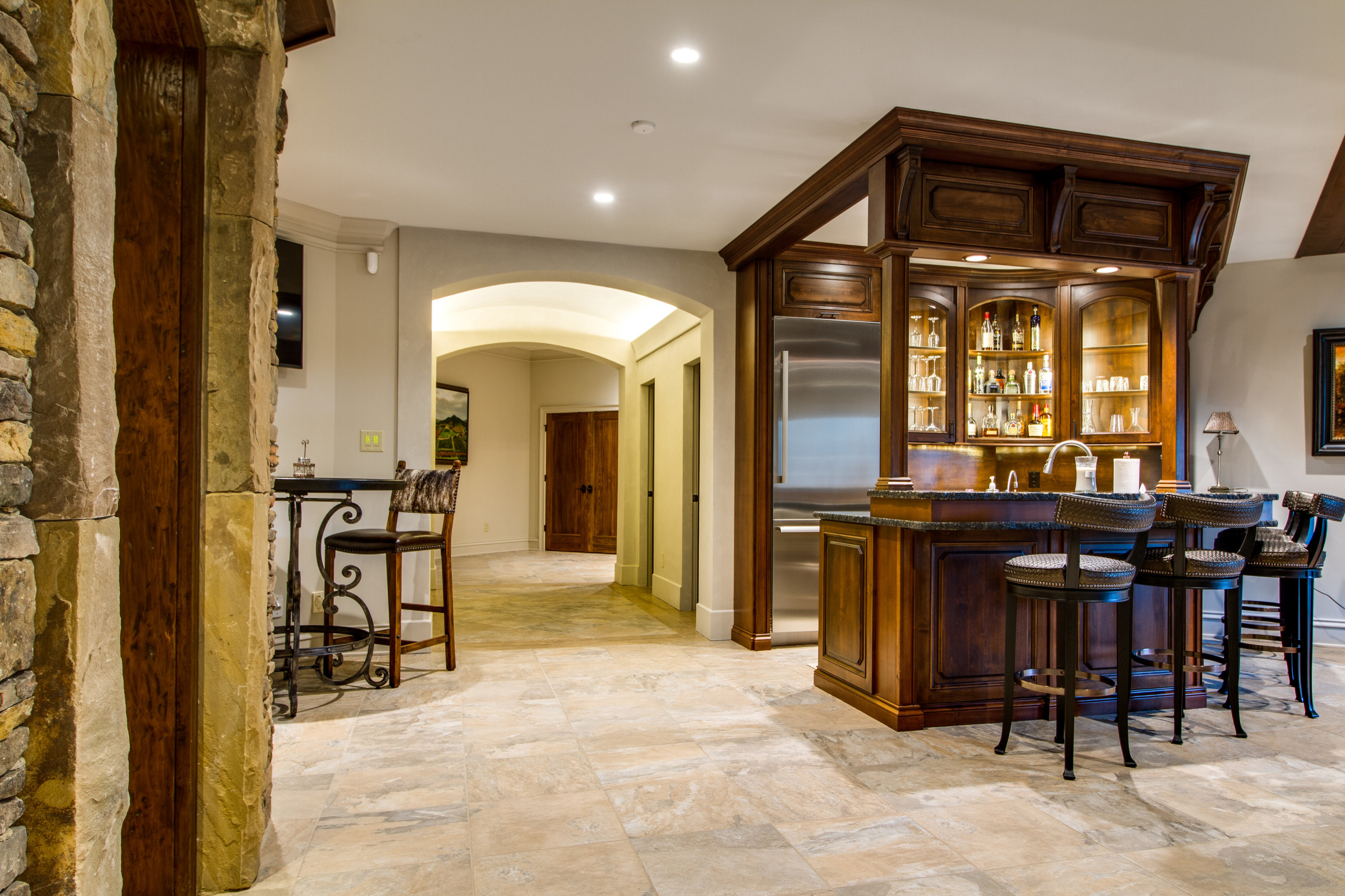 Home bar alder wood cabinetry matches the Wine Cellar