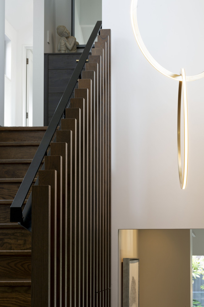 Design ideas for a contemporary Wood Straight staircase in Auckland With Wood Risers and Metal Railing.