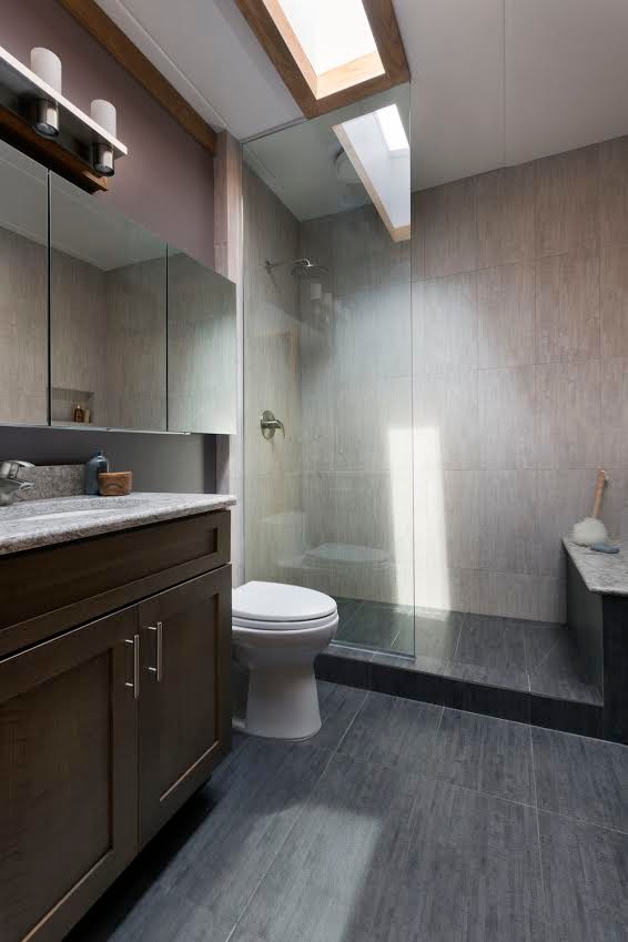 Inspiration for a small modern master bathroom in Milwaukee with recessed-panel cabinets, medium wood cabinets, an open shower, a one-piece toilet, gray tile, porcelain tile, purple walls, porcelain floors, an undermount sink, engineered quartz benchtops, grey floor and an open shower.