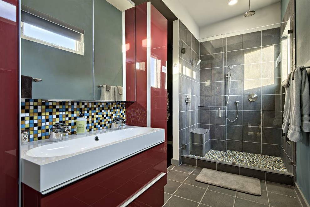 Design ideas for a small contemporary 3/4 bathroom in Austin with flat-panel cabinets, multi-coloured tile and ceramic tile.