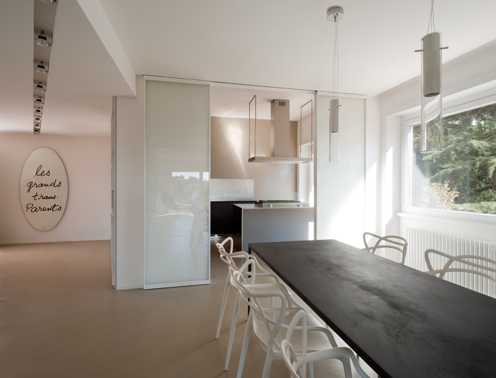 Photo of a contemporary dining room in Rome with white walls and porcelain floors.