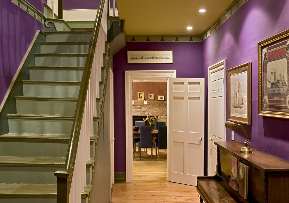 Traditional entryway in Burlington with purple walls.