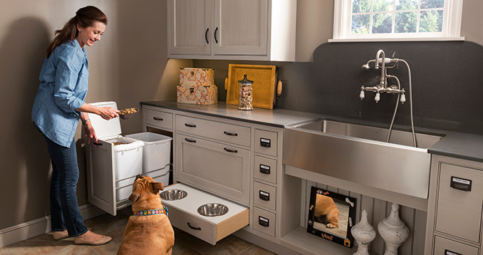 Inspiration for a mid-sized contemporary utility room in Houston with a farmhouse sink, soapstone benchtops, beige walls, ceramic floors, beige floor, beaded inset cabinets and grey cabinets.