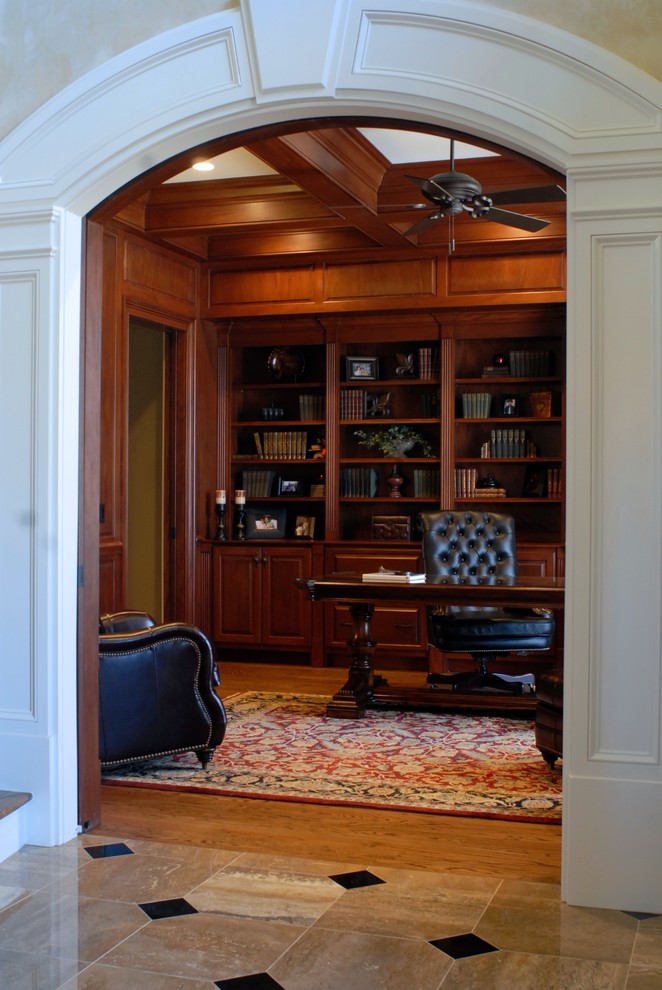 Inspiration for a mid-sized traditional home office in Other with light hardwood floors and a freestanding desk.