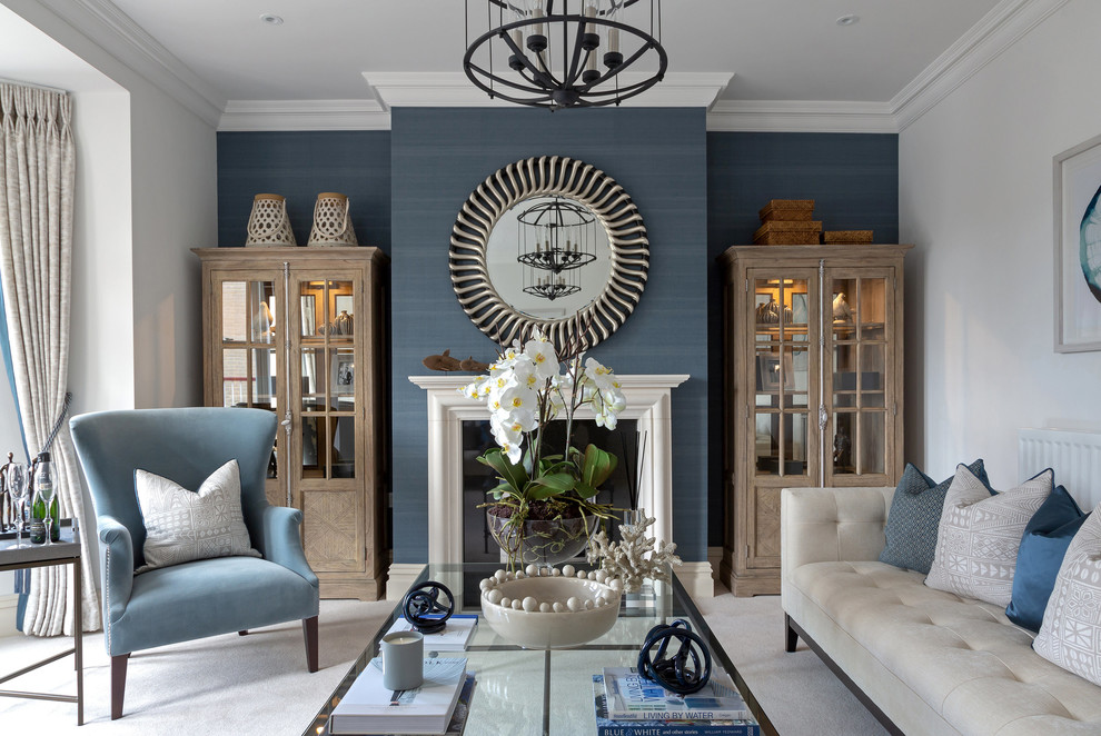Inspiration for a transitional enclosed living room in Buckinghamshire with white walls, carpet, a standard fireplace, a stone fireplace surround and grey floor.