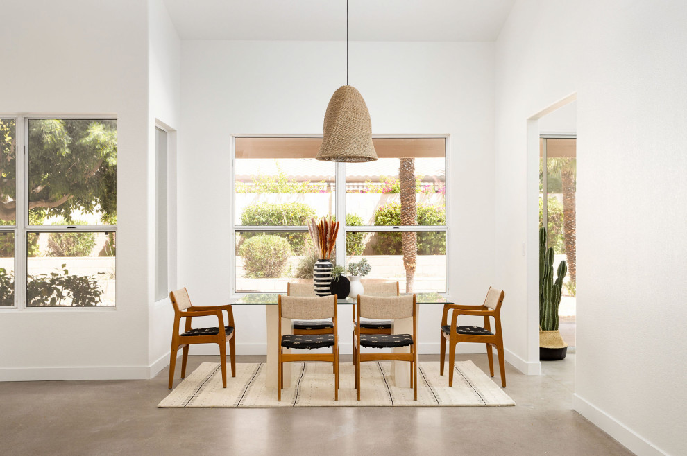 This is an example of a scandinavian dining room in Phoenix.