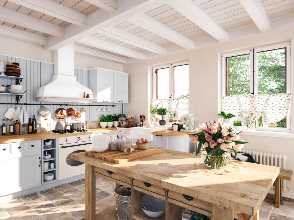 Design ideas for a mid-sized country single-wall eat-in kitchen with recessed-panel cabinets, blue cabinets, wood benchtops, blue splashback, timber splashback, white appliances, terra-cotta floors, with island, brown floor, exposed beam, an undermount sink and brown benchtop.
