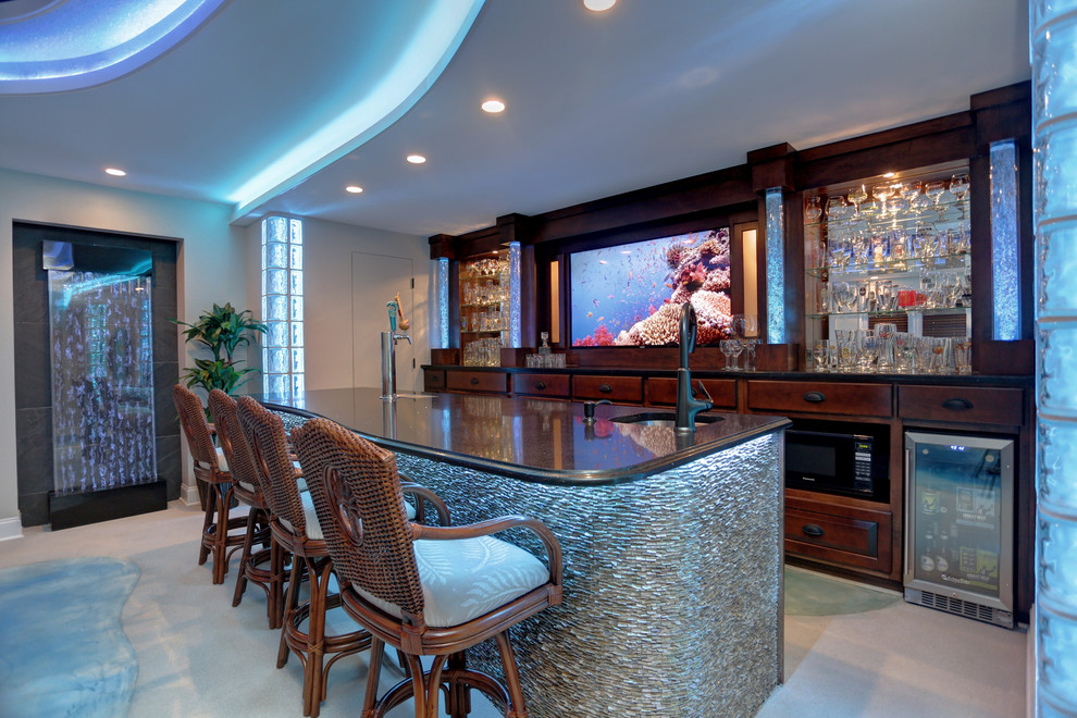 Design ideas for a mid-sized beach style galley seated home bar in Atlanta with concrete floors, an undermount sink, glass-front cabinets, dark wood cabinets, granite benchtops and blue floor.