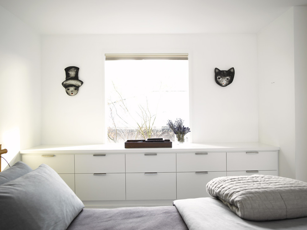 Design ideas for a contemporary bedroom in Seattle with white walls.