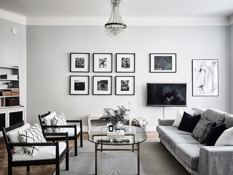 Inspiration for a large scandinavian formal open concept living room in Gothenburg with grey walls, medium hardwood floors, no fireplace and no tv.