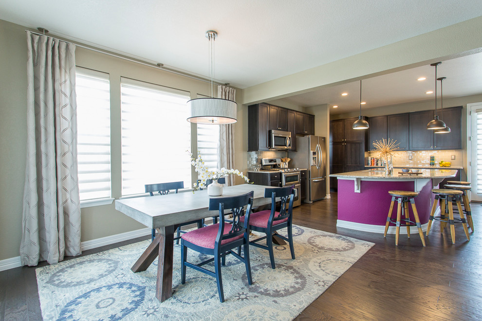 Example of a mid-sized eclectic dark wood floor and brown floor kitchen/dining room combo design in Denver with beige walls and no fireplace