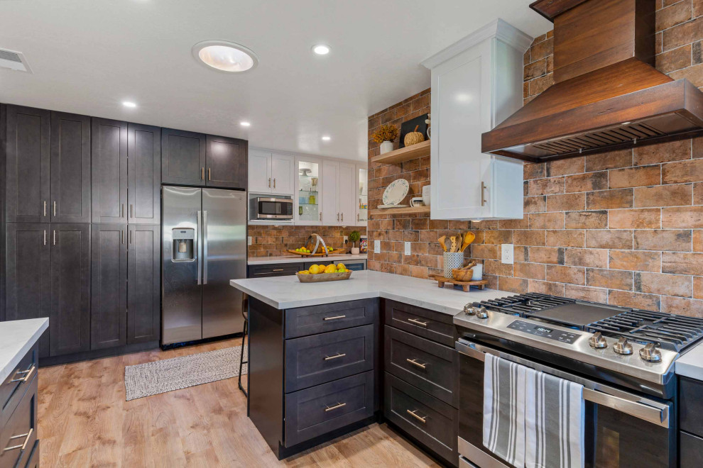 Kitchen pantry - mid-sized rustic u-shaped light wood floor and brown floor kitchen pantry idea in San Francisco with a single-bowl sink, shaker cabinets, white cabinets, quartz countertops, brown backsplash, porcelain backsplash, stainless steel appliances, a peninsula and white countertops