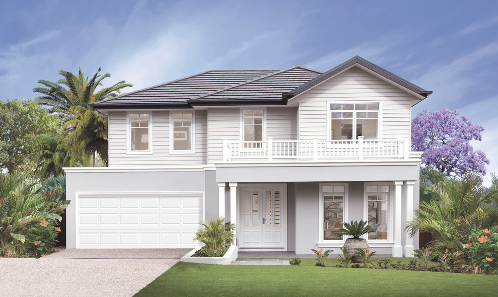 This is an example of a beach style two-storey house exterior in Brisbane with a gable roof.