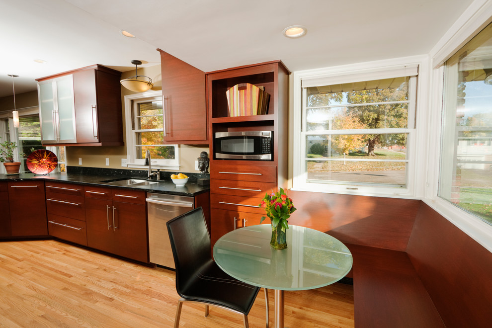 Mid-sized contemporary kitchen/dining combo in Minneapolis with light hardwood floors, beige walls and no fireplace.