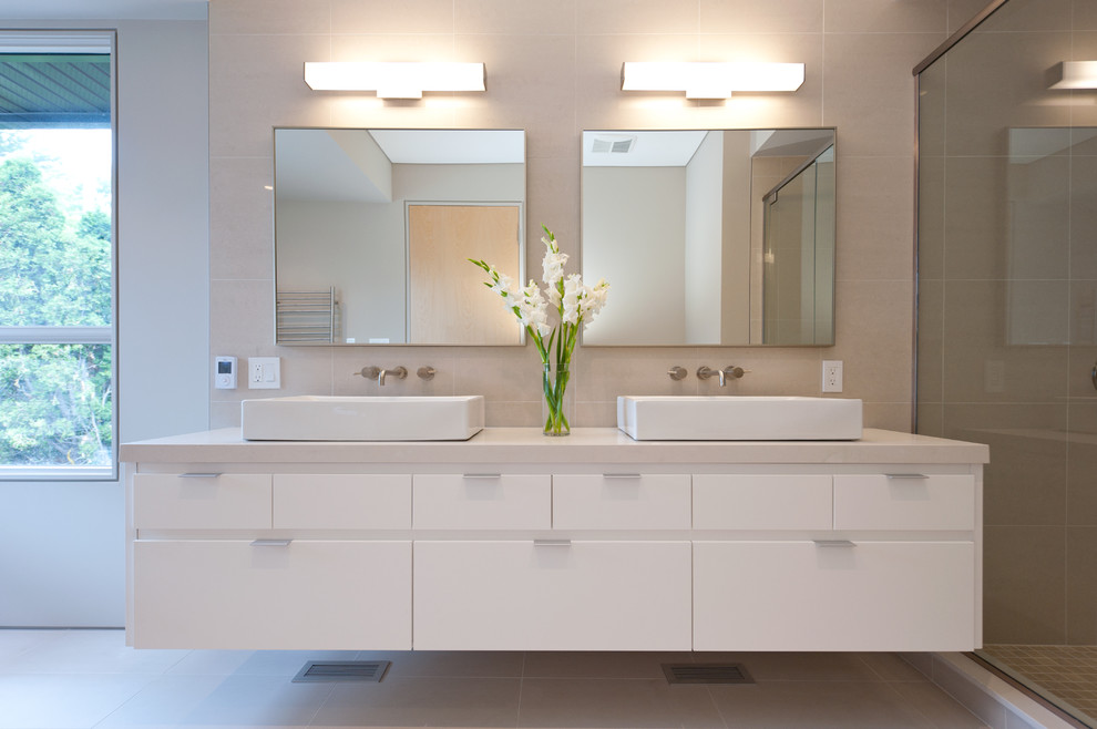 Large contemporary master bathroom in Ottawa with a vessel sink, flat-panel cabinets and white cabinets.