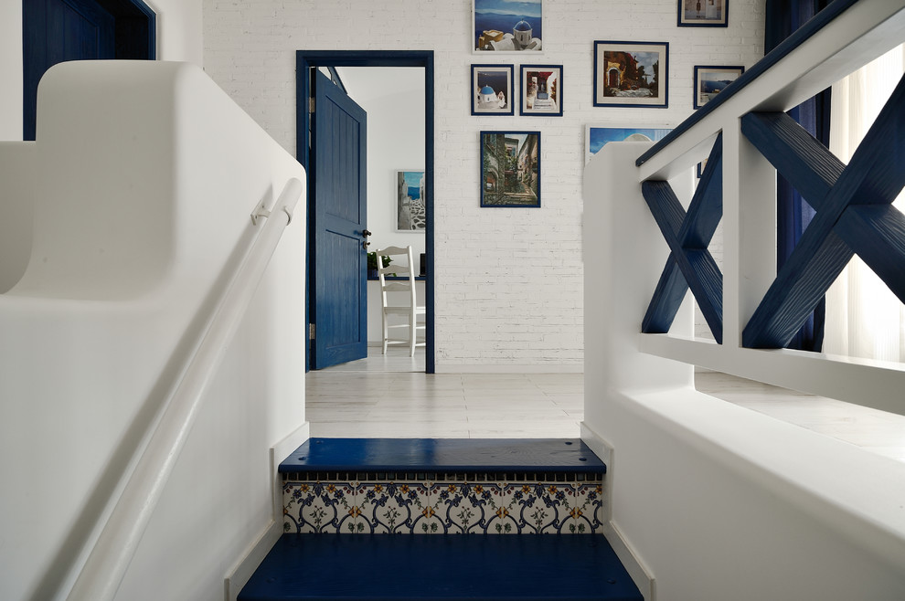 This is an example of a mediterranean staircase in Hong Kong with tile risers.