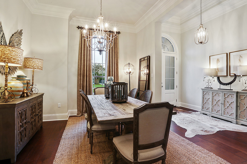 Mid-sized traditional open plan dining in New Orleans with beige walls and medium hardwood floors.