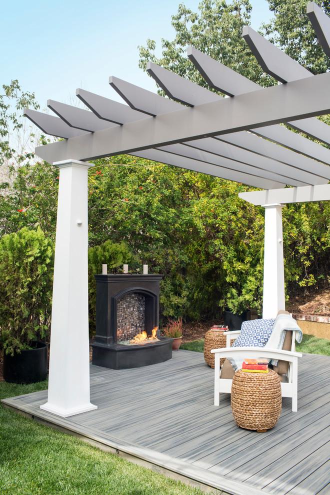 Photo of an arts and crafts backyard patio in Los Angeles with a pergola.
