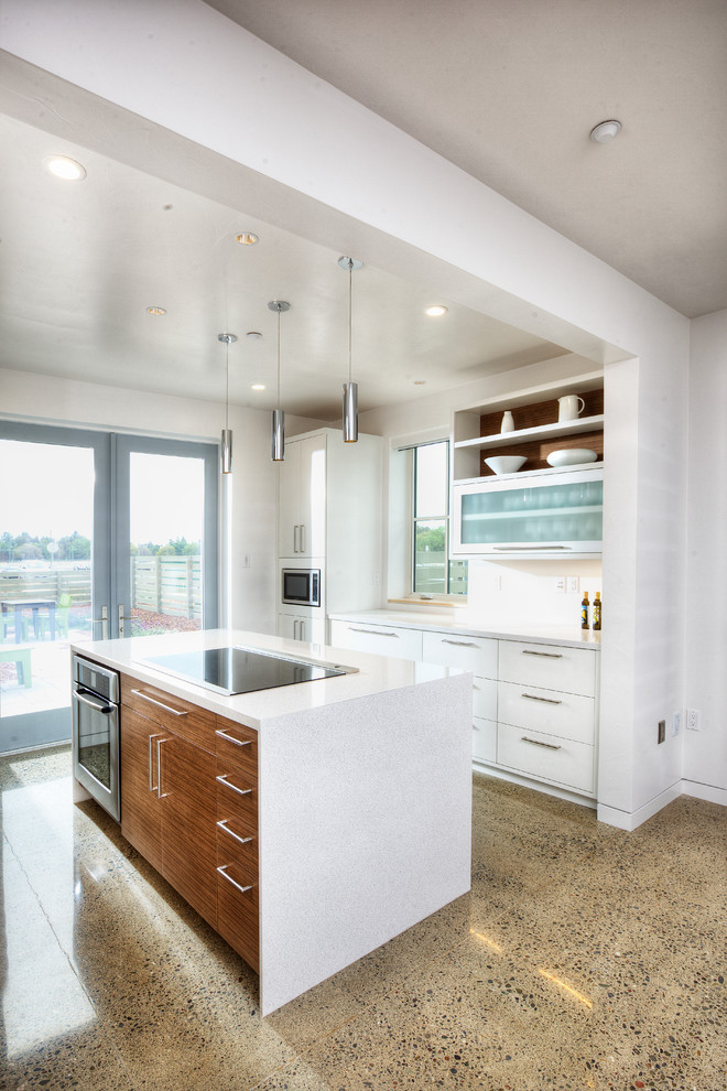 Design ideas for a mid-sized contemporary galley open plan kitchen in Sacramento with an undermount sink, flat-panel cabinets, white cabinets, quartz benchtops, grey splashback, glass tile splashback, stainless steel appliances, terrazzo floors, with island and beige floor.