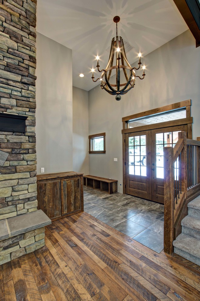 Front door - large rustic medium tone wood floor front door idea in Seattle with gray walls and a medium wood front door