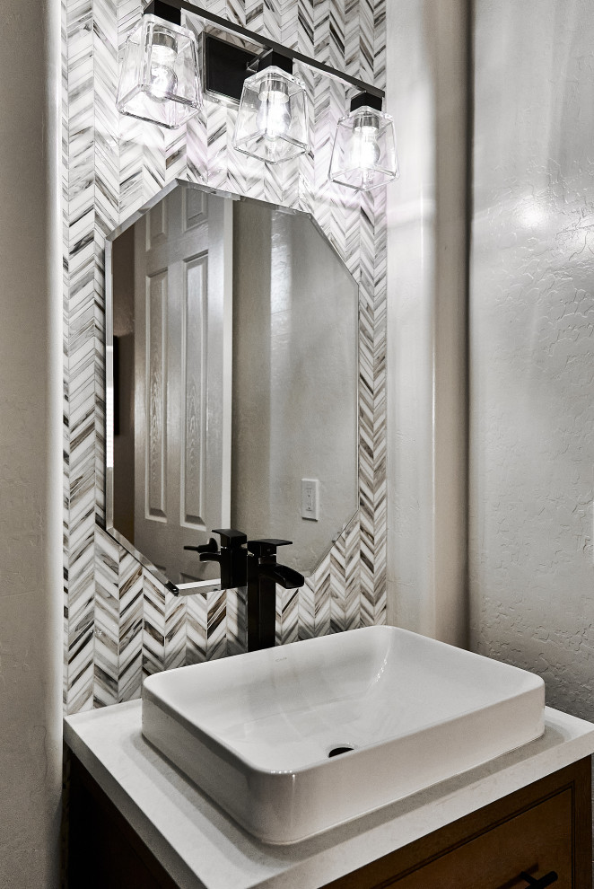 Design ideas for a medium sized classic cloakroom in Phoenix with medium wood cabinets, a one-piece toilet, multi-coloured tiles, mosaic tiles, white walls, porcelain flooring, engineered stone worktops, brown floors, white worktops, a freestanding vanity unit, shaker cabinets and a vessel sink.