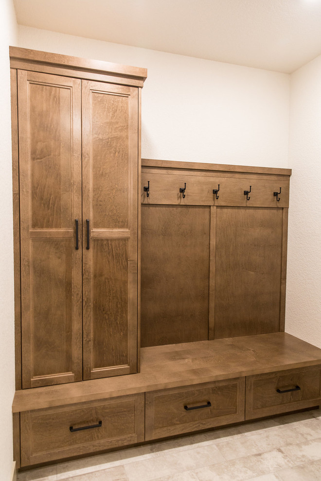 Large transitional ceramic tile and multicolored floor mudroom photo with white walls