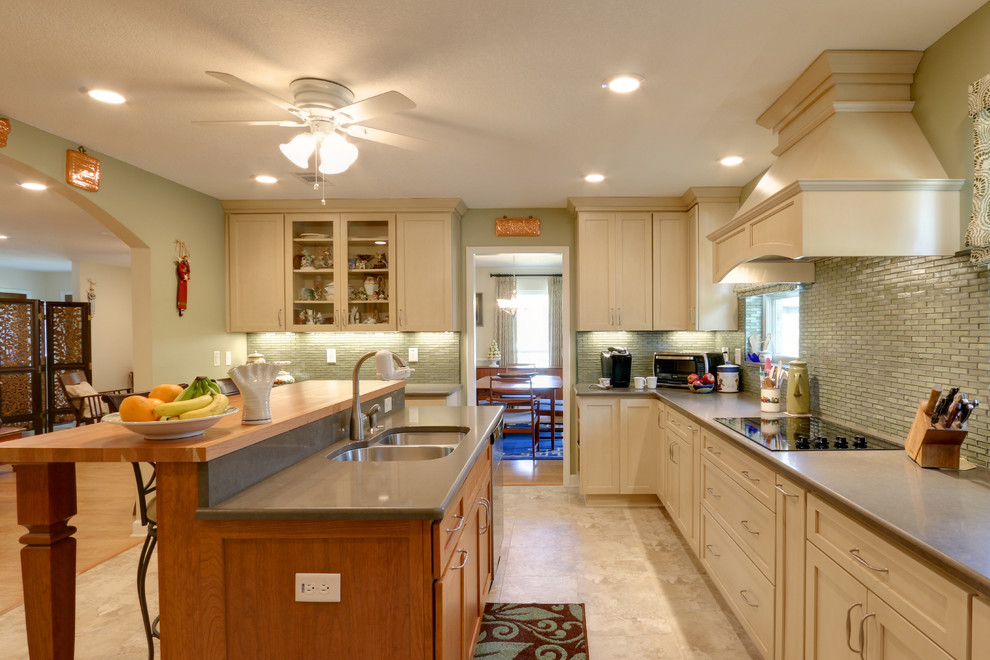 Inspiration for a huge transitional u-shaped vinyl floor kitchen remodel in Miami with an undermount sink, shaker cabinets, light wood cabinets, quartz countertops, green backsplash, glass tile backsplash, stainless steel appliances and an island