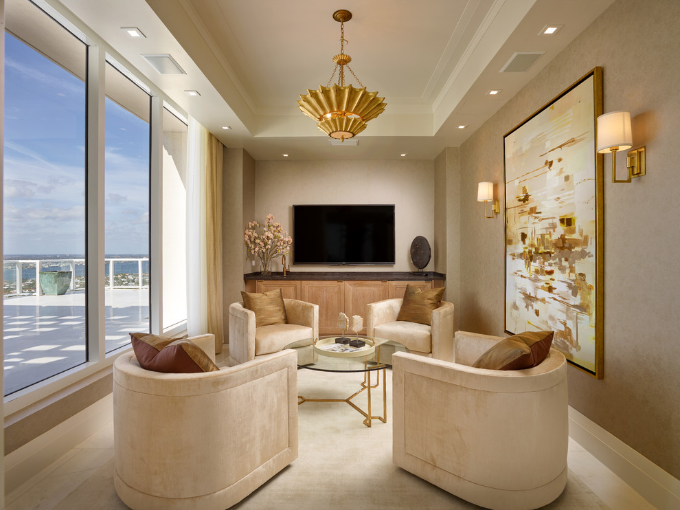 Photo of a large transitional open concept family room in Miami with brown walls, marble floors and a wall-mounted tv.
