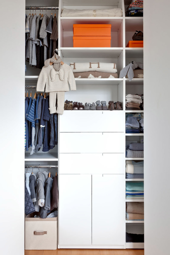 Inspiration for a contemporary built-in wardrobe in New York with open cabinets and white cabinets.
