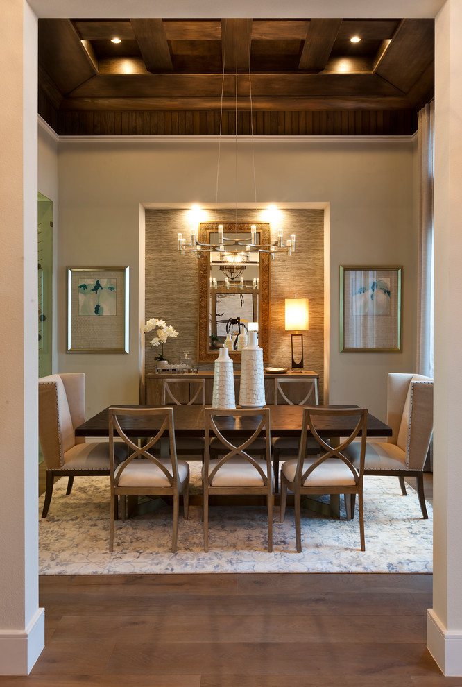 Large transitional medium tone wood floor and beige floor enclosed dining room photo in Tampa with beige walls