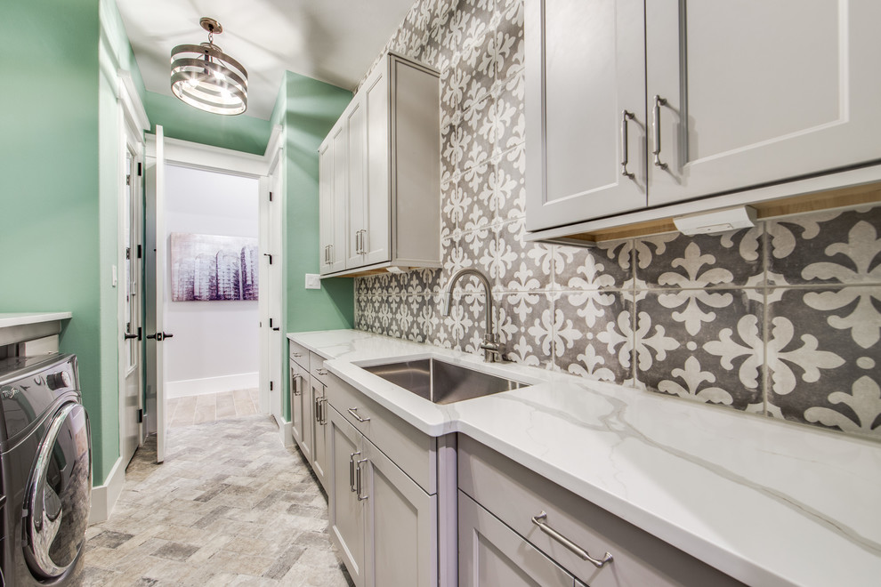 Inspiration for a large country galley laundry room in Dallas with an undermount sink, shaker cabinets, grey cabinets, quartz benchtops, green walls, ceramic floors and multi-coloured floor.