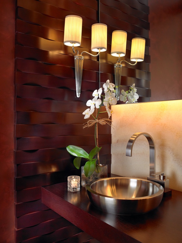 This is an example of a contemporary powder room in Miami with wood benchtops and red benchtops.