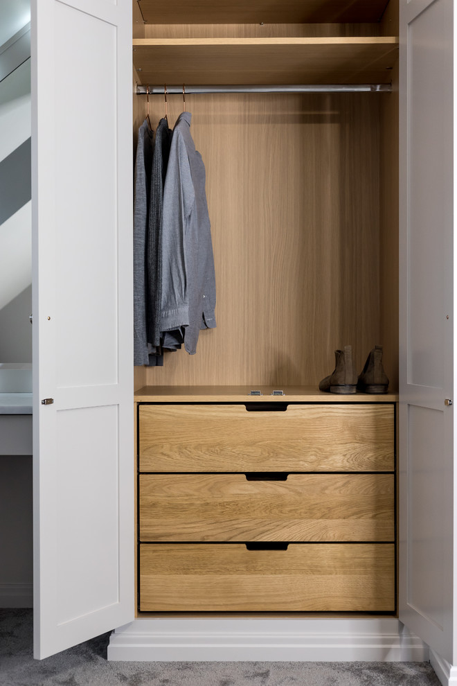 This is an example of a contemporary storage and wardrobe in Hertfordshire.