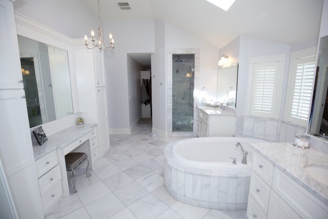 Design ideas for a large country master bathroom in Chicago with white cabinets, a drop-in tub, an alcove shower, gray tile, porcelain tile, grey walls, porcelain floors, an undermount sink, granite benchtops, shaker cabinets, a two-piece toilet, grey floor and a hinged shower door.