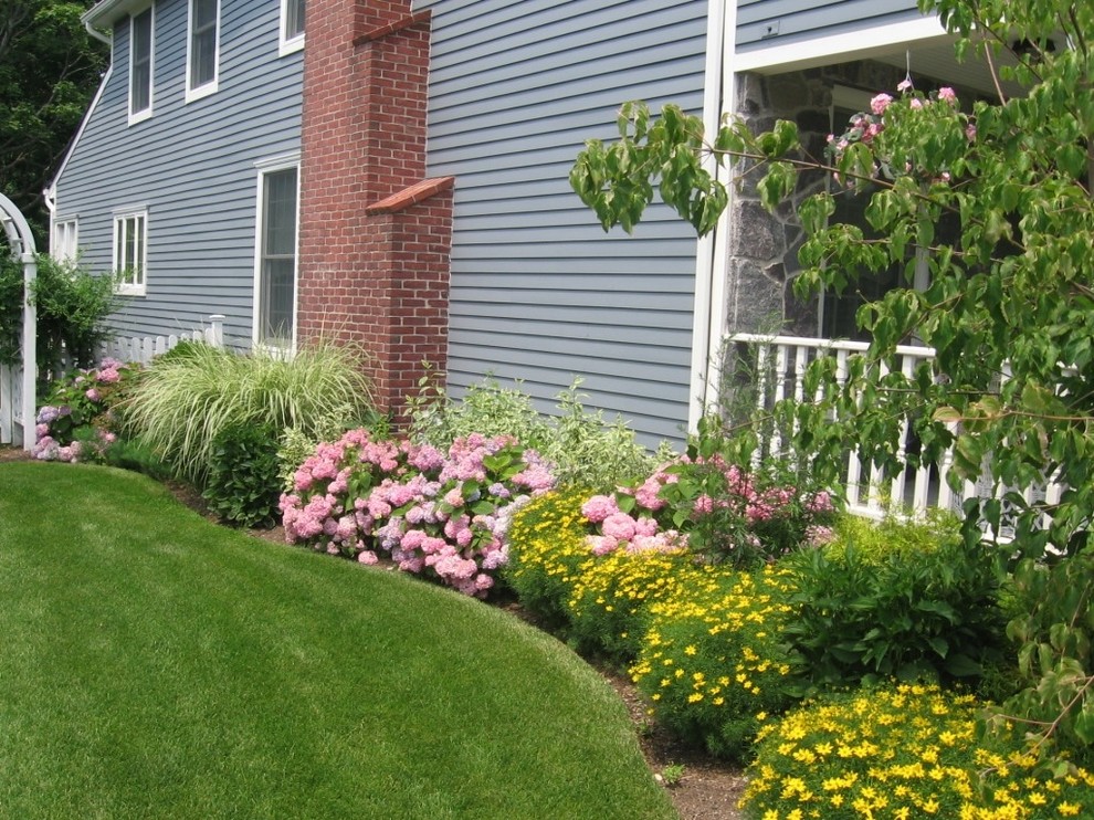 Photo of a traditional side yard garden in New York with a garden path and natural stone pavers.