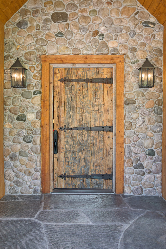 Front door - rustic front door idea with a medium wood front door