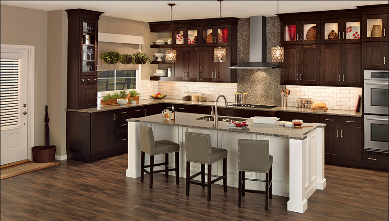 Eat-in kitchen - mid-sized transitional l-shaped dark wood floor and brown floor eat-in kitchen idea with a double-bowl sink, shaker cabinets, dark wood cabinets, granite countertops, white backsplash, subway tile backsplash, stainless steel appliances and an island