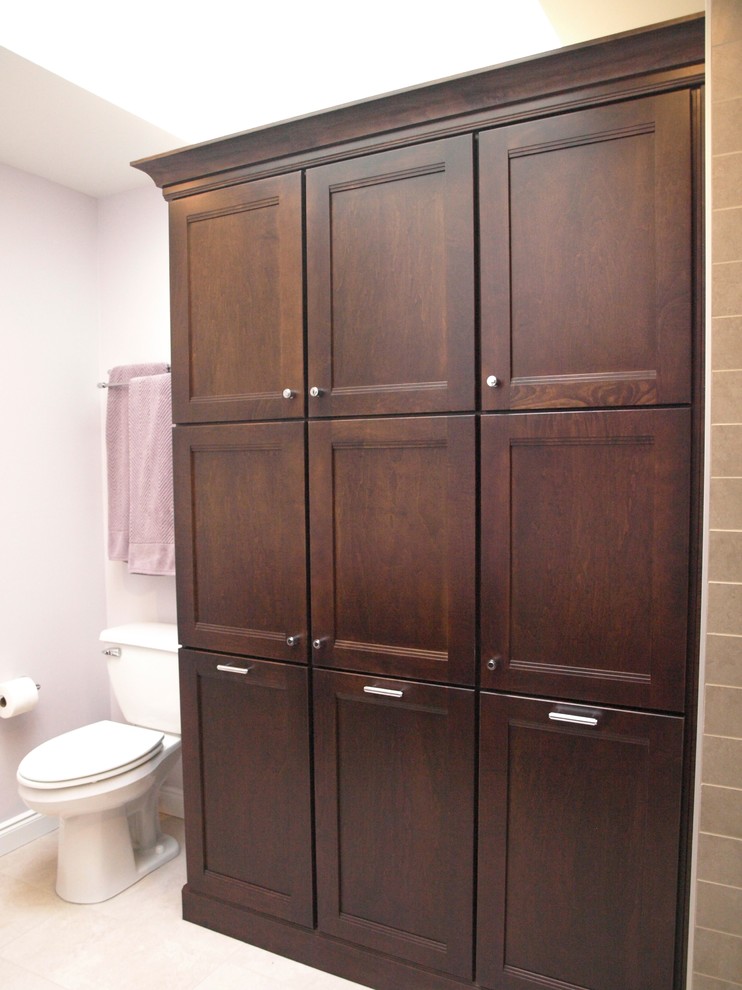 Large transitional master bathroom in Newark with flat-panel cabinets, brown cabinets, an alcove shower, a two-piece toilet, beige tile, ceramic tile, beige walls, porcelain floors, an undermount sink, granite benchtops, beige floor and a sliding shower screen.
