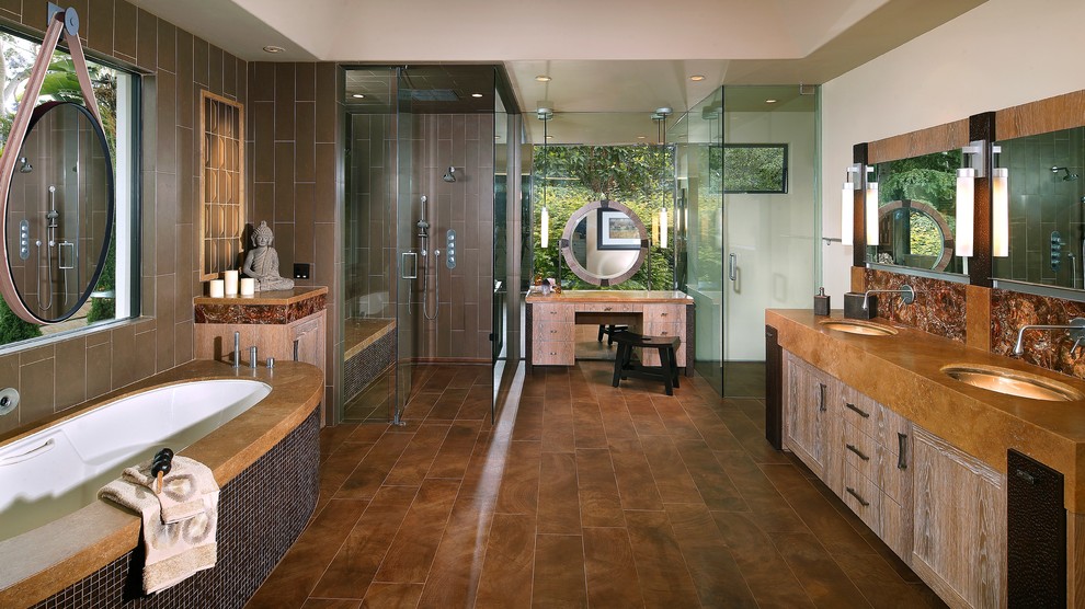 Photo of a large asian master bathroom in Orange County with a hot tub, a corner shower, gray tile, ceramic tile, grey walls, medium hardwood floors, an undermount sink, copper benchtops, brown floor and a hinged shower door.